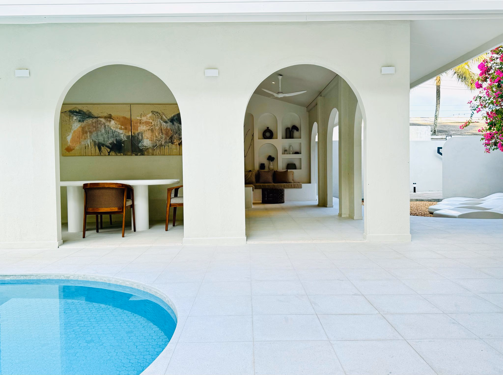 The Suite - Suite exterior illuminated, creating a warm and inviting evening ambiance.