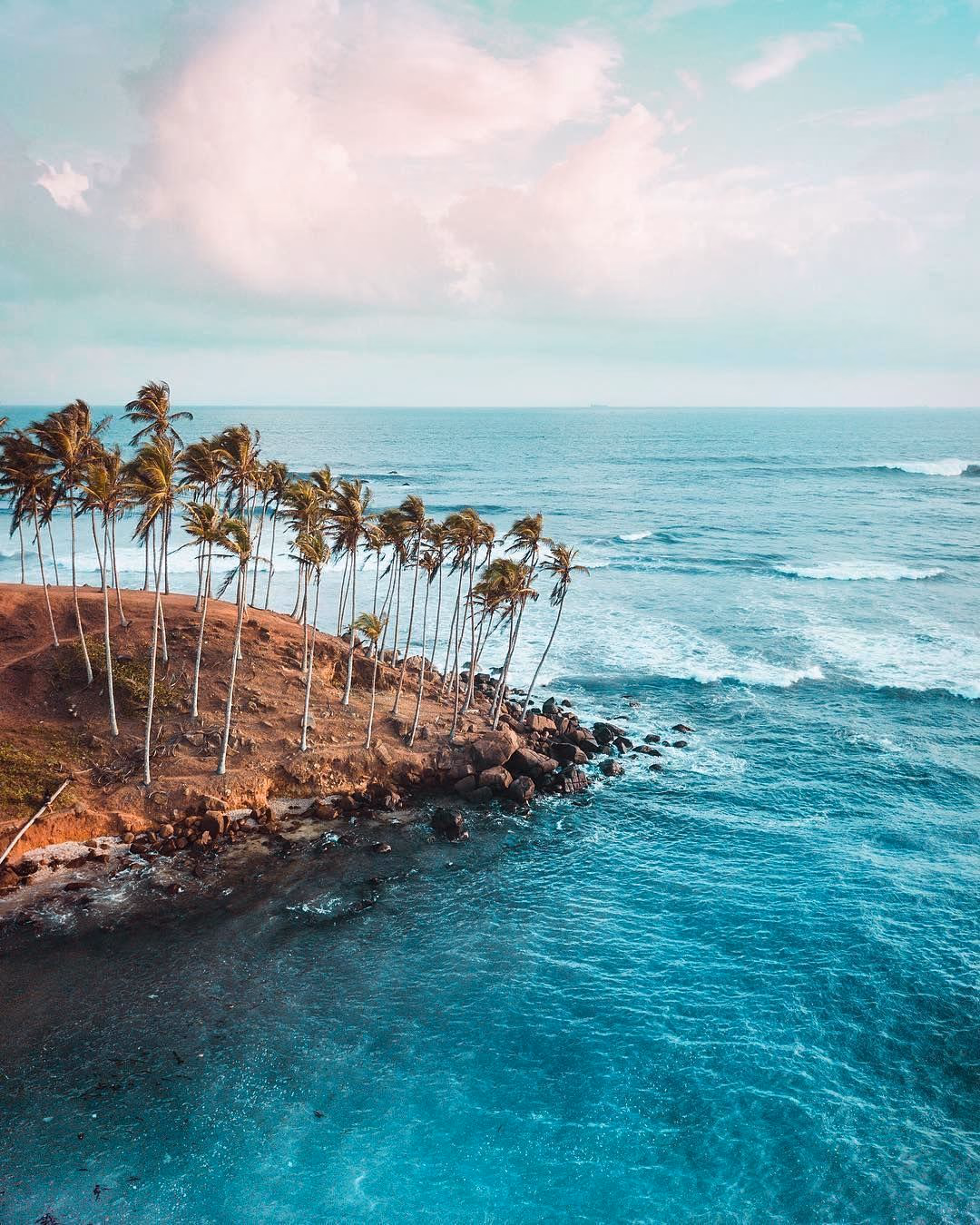 Surfer riding a wave at Kabalana Beach, a popular surf spot near K2 Villa, Ahangama.